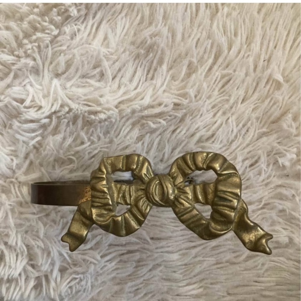 Brass bow curtain tie back